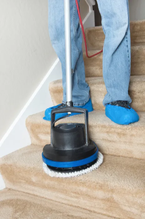 cleaning carpet on stairs with professional tools
