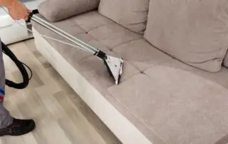 Residential and commercial interior cleaning in Phoenix by First Class Green Cleaning showing person cleaning furniture