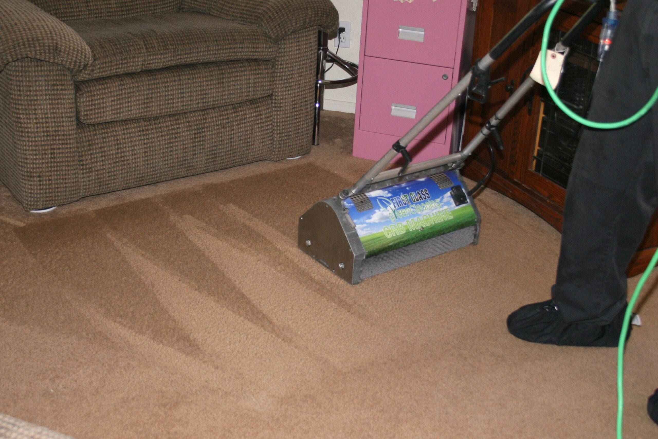 Residential and commercial interior cleaning in Phoenix by First Glass Green Cleaning showing carpet cleaning machine