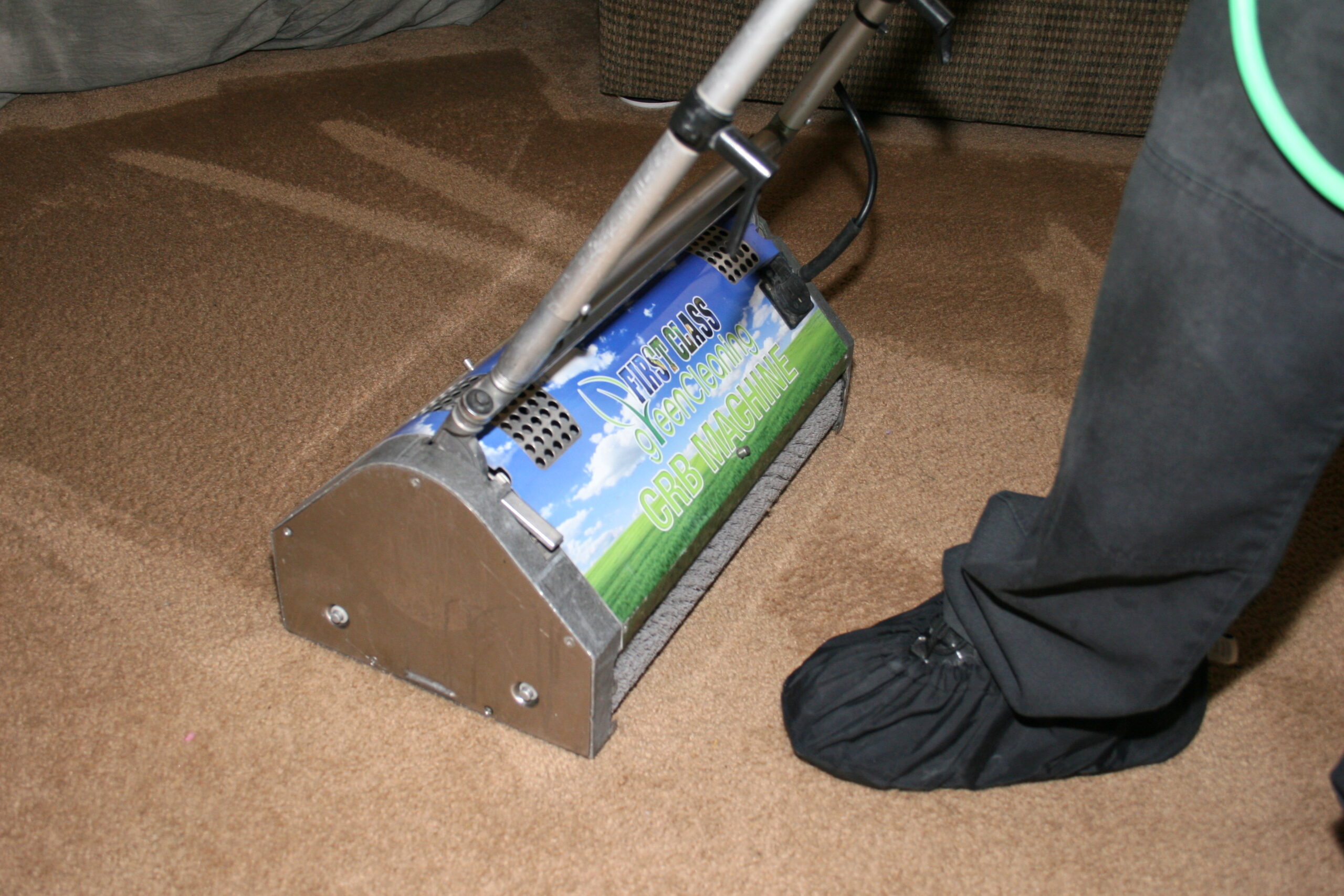 Residential and commercial interior cleaning in Phoenix by First Glass Green Cleaning showing carpet cleaning machine