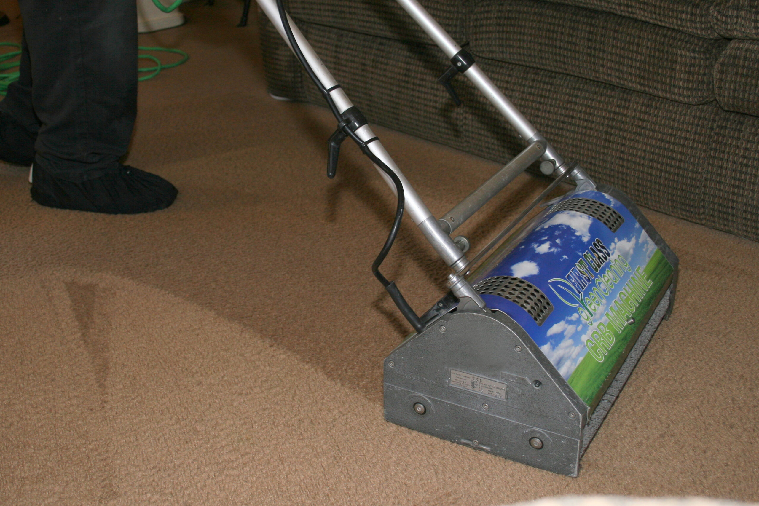 Residential and commercial interior cleaning in Phoenix by First Glass Green Cleaning showing carpet cleaning machine