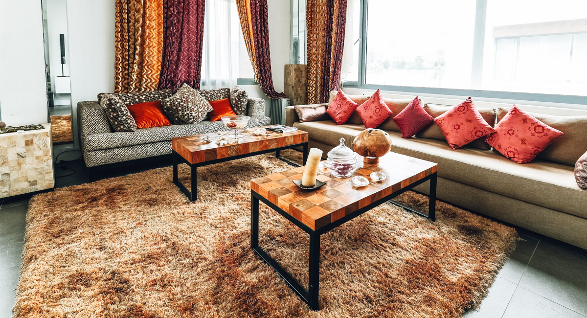 A living room with a nice, large rug