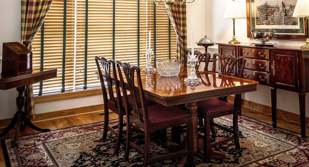 Dining table and chairs on a patterned area rug