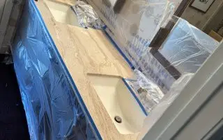 Bathroom vanity masked with plastic before countertop polishing