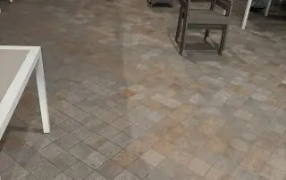 PCCPatioTile7-25 Patterned patio tile at a commercial venue during cleaning