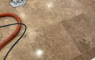 Travertine floor test area before stone polishing