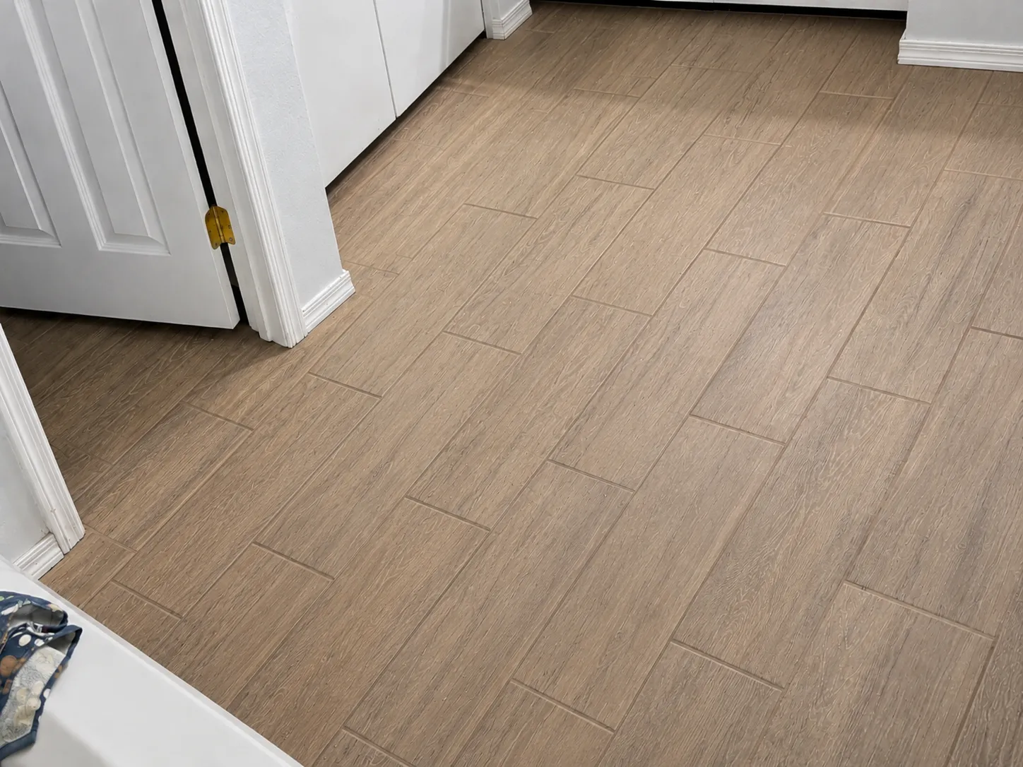 Wood-look tile floor with clean grout lines after cleaning